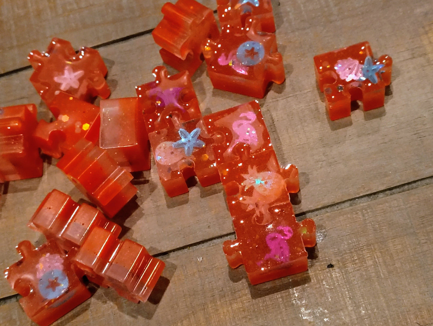 Bright Florescent Neon Orange Sparkly Glow in the Dark Glitter Resin Fidget Puzzle with Coastal Figures